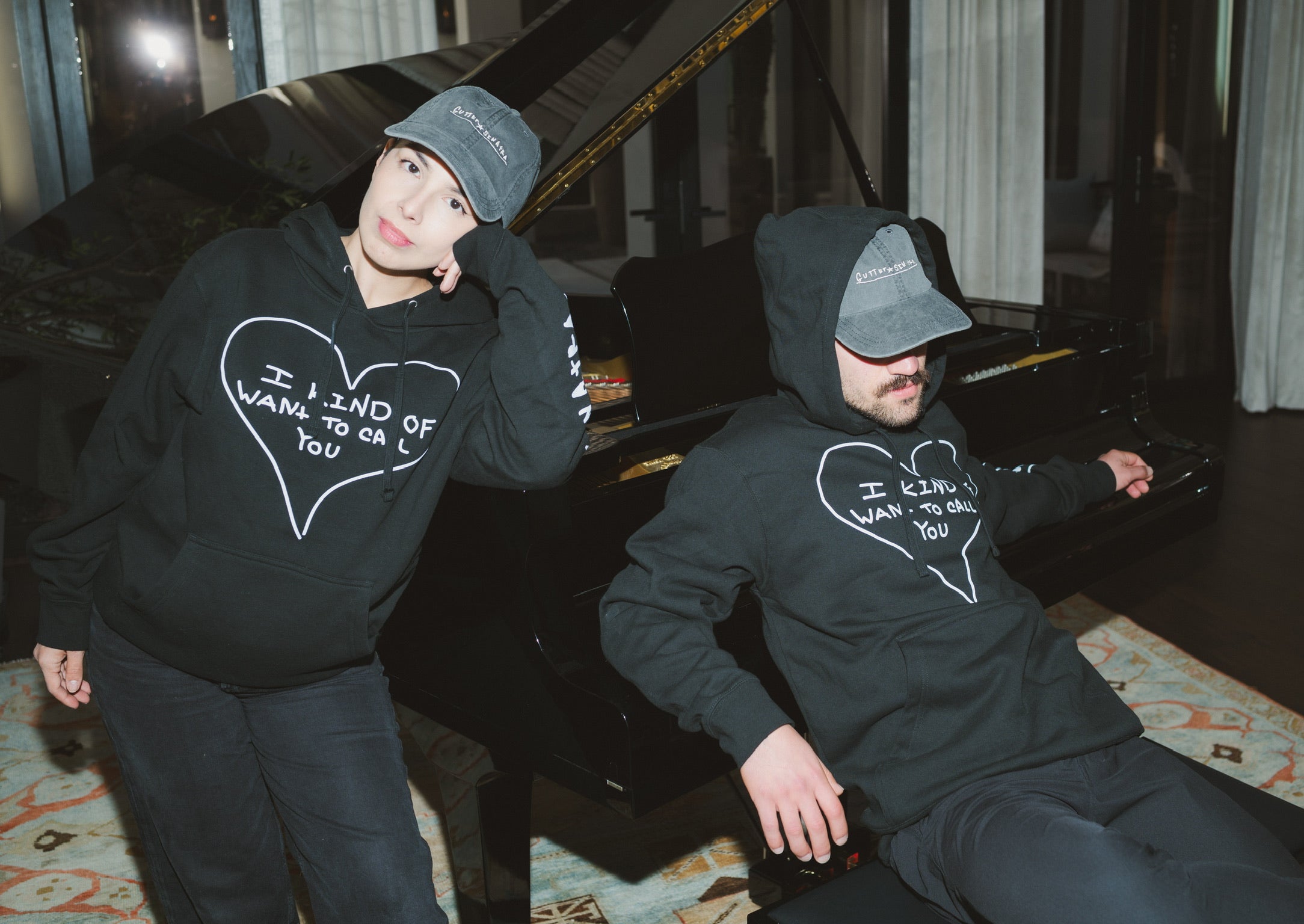 Models wearing Gutter Sinatra sweatshirt and hat